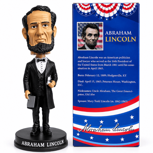 Abraham Lincoln bobblehead figurine in box packaging; base reads ABRAHAM LINCOLN