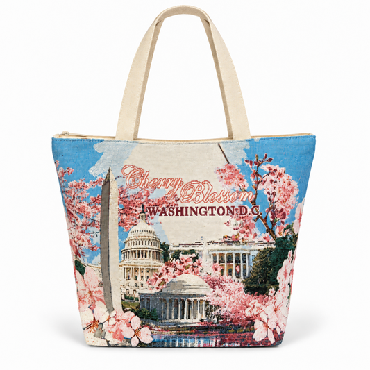 Front-facing blue tote bag with cherry blossom Washington DC text and Capitol scene.