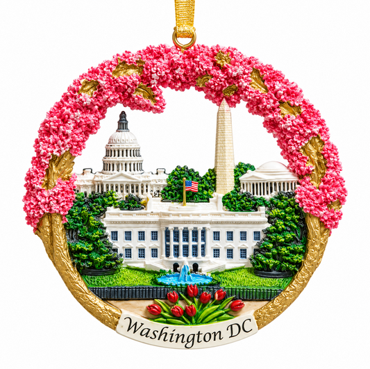 Hanging ceramic Washington DC ornament with pink cherry blossom wreath and white landmark buildings