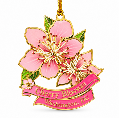 Pink cherry blossom metal Christmas ornament close-up with gold loop and 'Cherry Blossom Washington, DC'