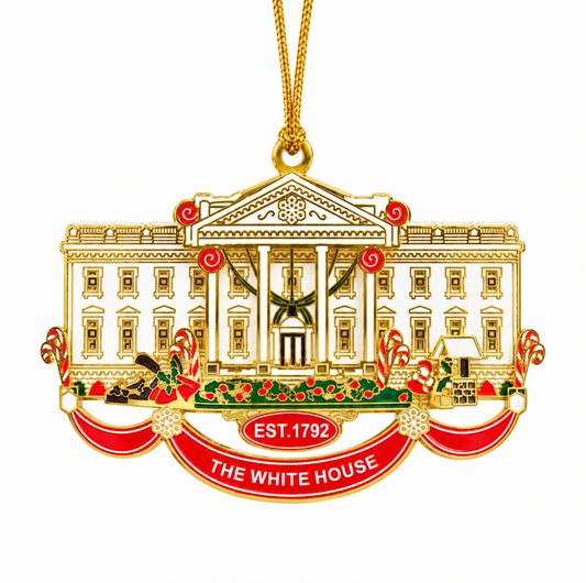 Gold-tone metal Christmas ornament with White House facade, columns, and red accents