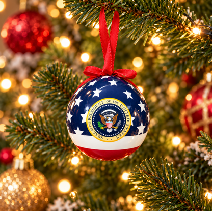 Patriotic ball ornament with red ribbon, blue stars, and Washington, DC seal